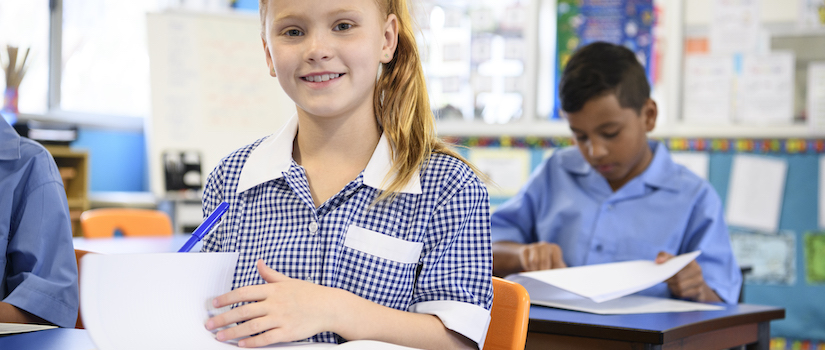 “student-at-desk-in-classroom“