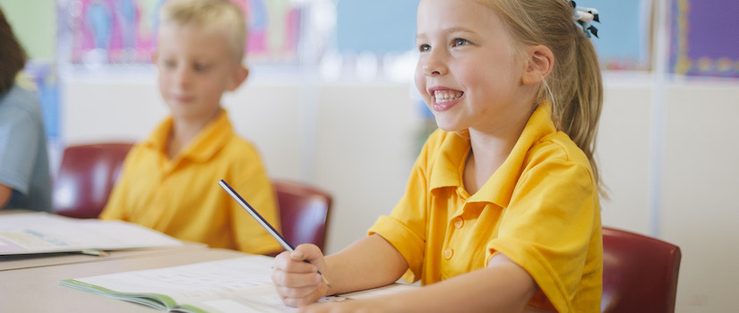 “students-at-desk-in-classroom“