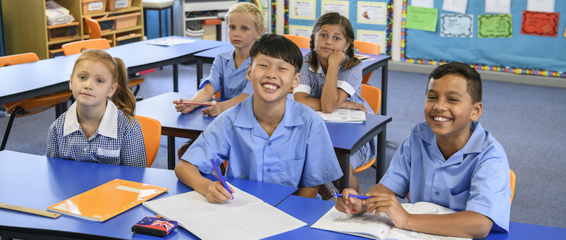 “students-at-desks-in-classroom“