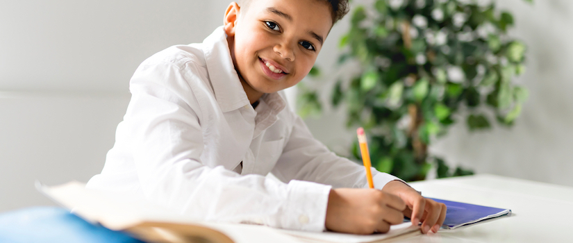 “student-at-desk-in-classroom“