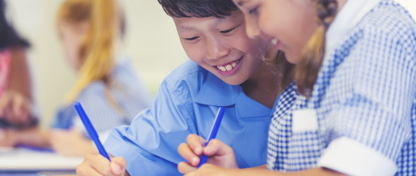 “students-at-desk-in-classroom“