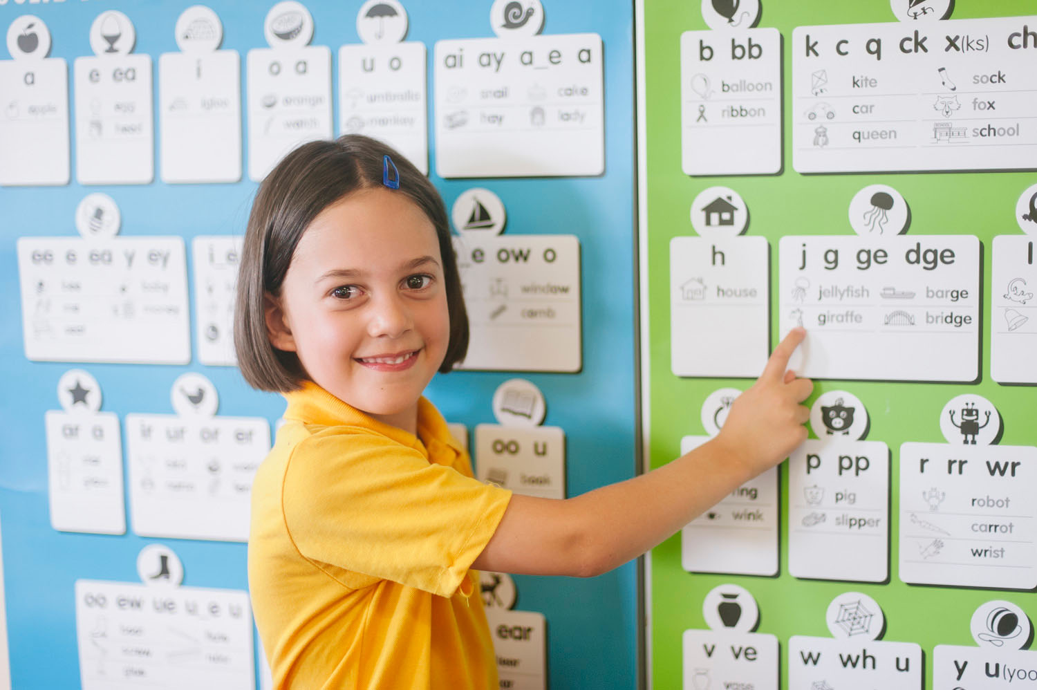 student with wall chart