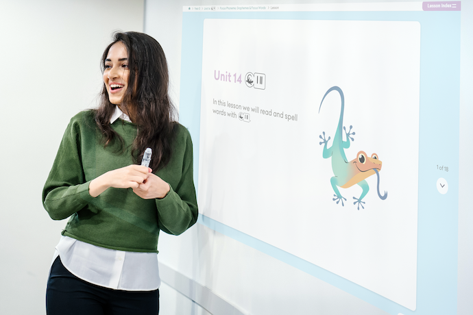 teacher teaching with slideshow